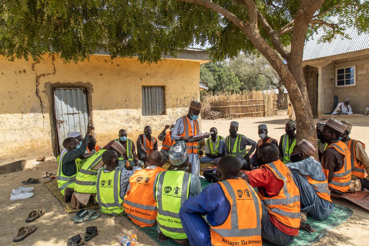 A men’s group meet in a community in Jigawa state