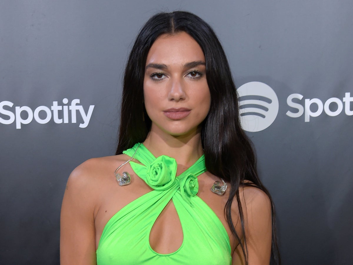 Dua Lipa sparks debate after wearing nearly white sheer lace dress to wedding: ‘A rare L from my queen’