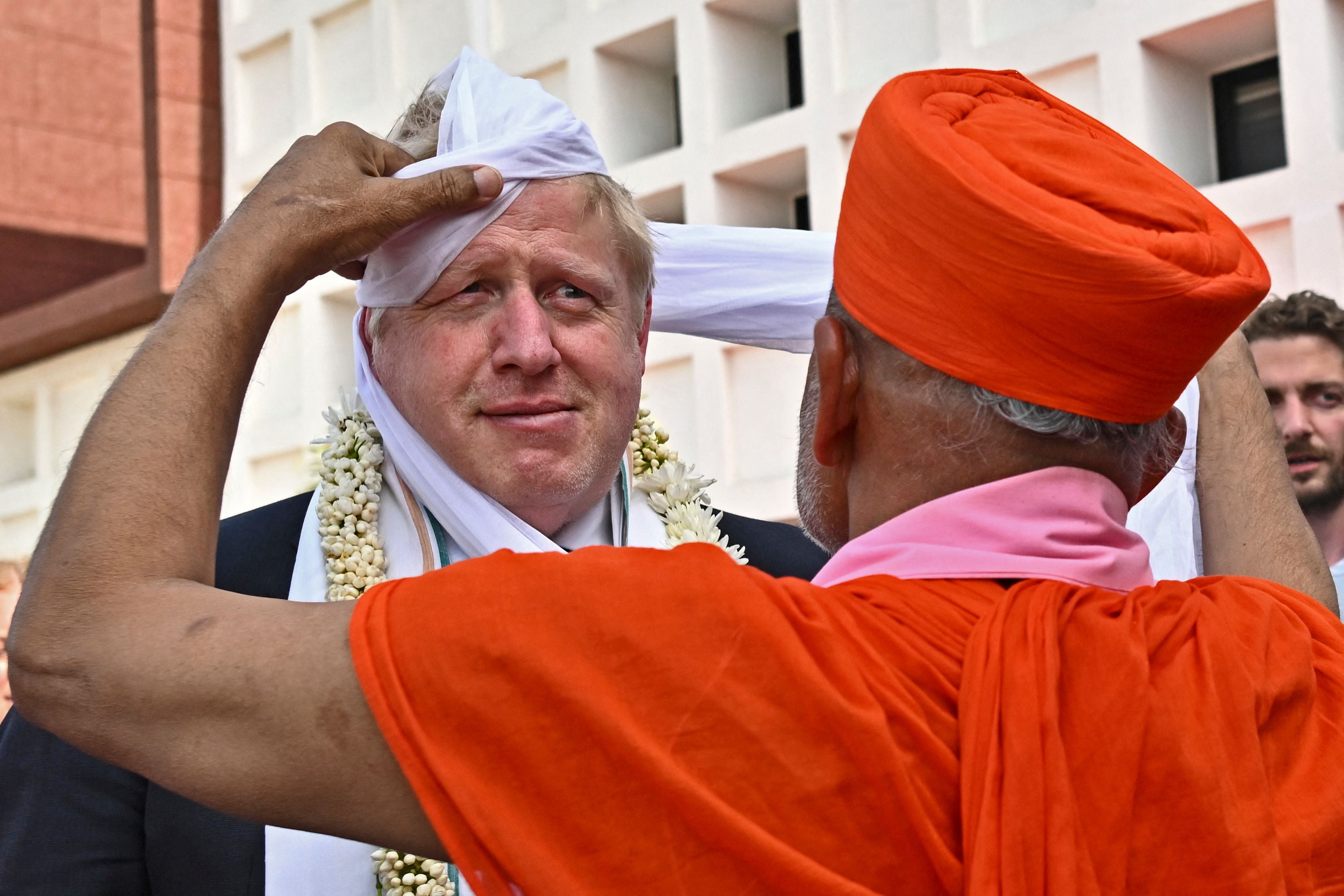 MrJohnson gets a traditional turban upon his arrival at the Gujarat Biotechnology University in April