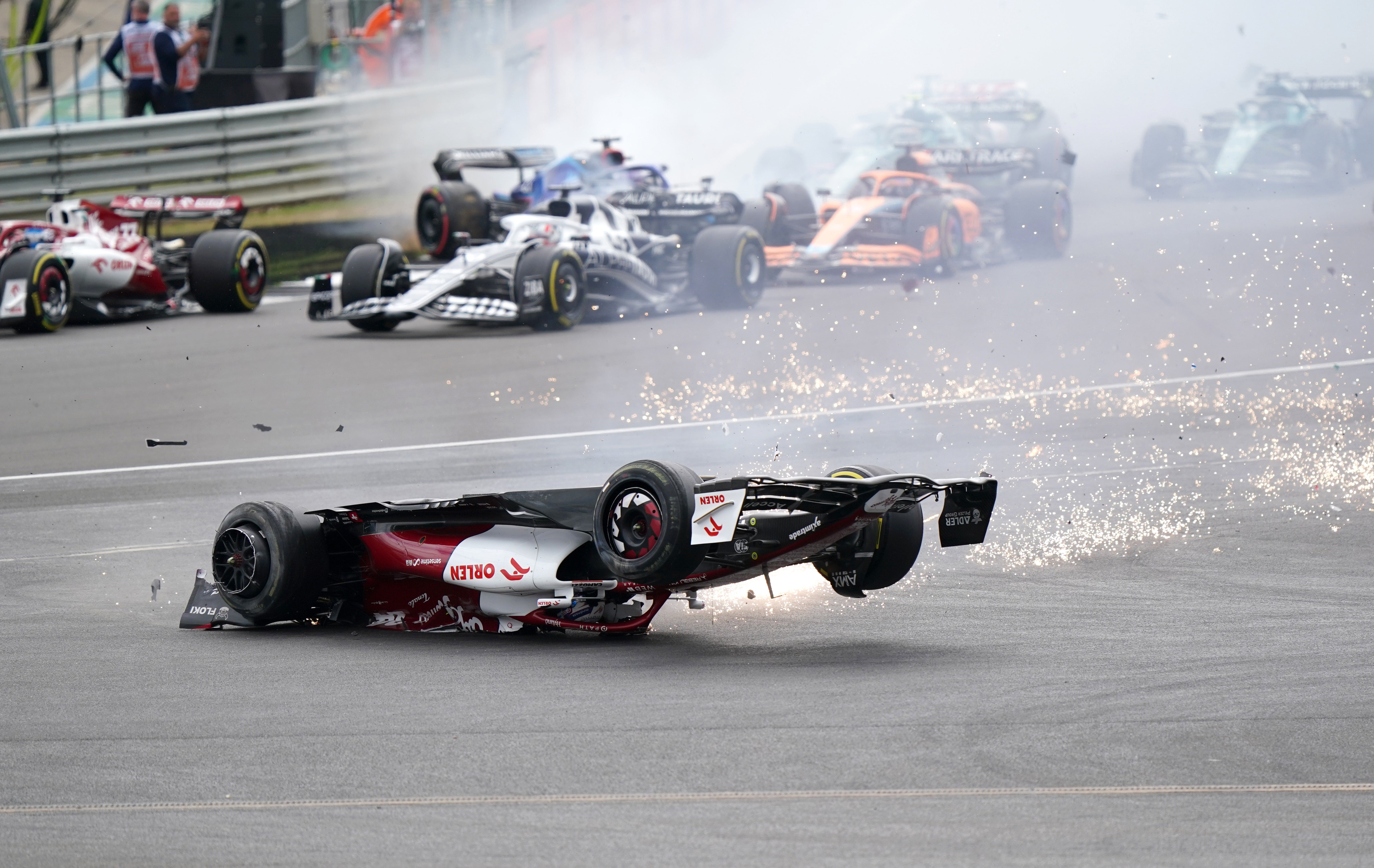 Zhou Guanyu slides towards the barrier at Silverstone (Tim Goode/PA)