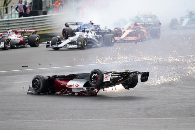 <p>Zhou Guanyu slides towards the barrier at Silverstone (Tim Goode/PA)</p>