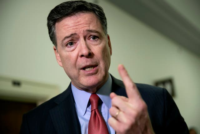 <p>James Comey speaks to journalists on Capitol Hill </p>
