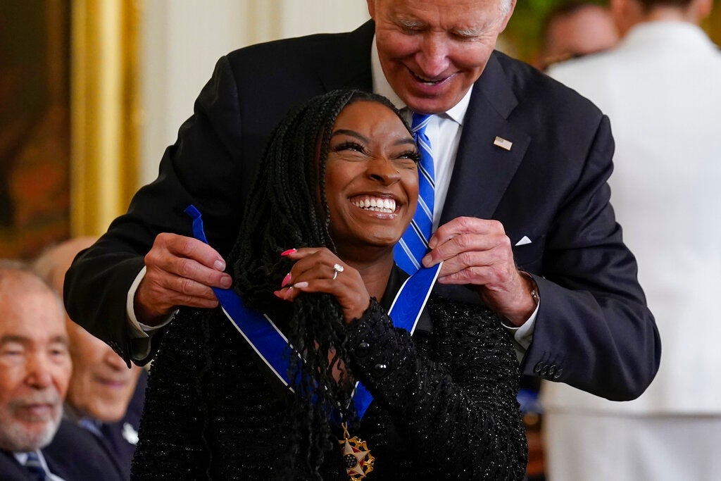 <p>President Joe Biden awards the nation's highest civilian honor, the Presidential Medal of Freedom, to Simone Biles at the White House in Washington, Thursday, July 7, 2022. (AP Photo/J. Scott Applewhite)</p>
