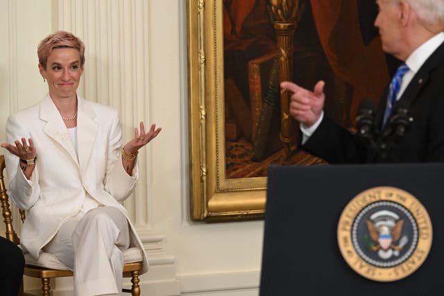 <p>US President Joe Biden acknowledges US soccer player Megan Rapinoe before presenting her with the Presidential Medal of Freedom</p>