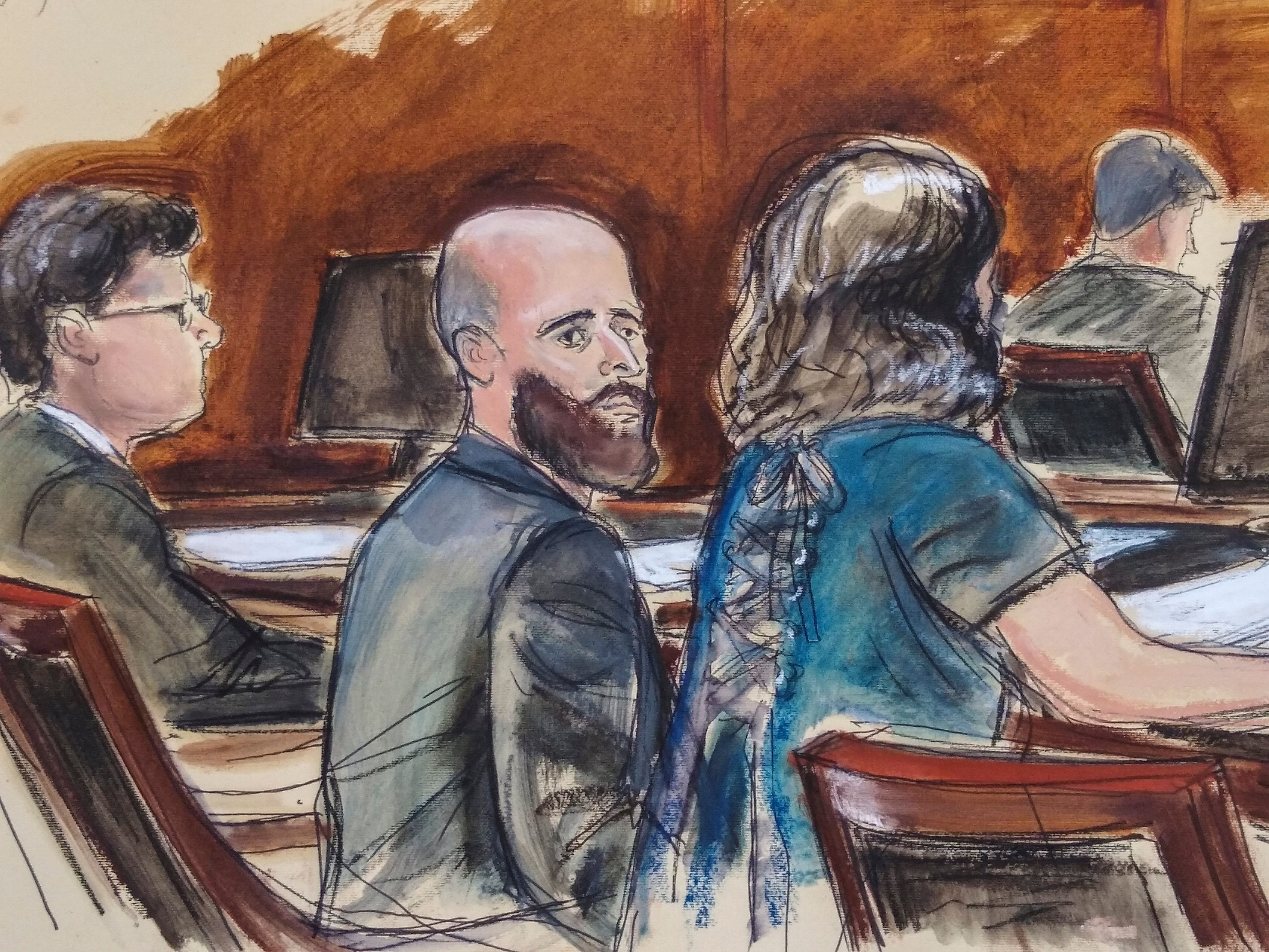 In this courtroom sketch, Joshua Schulte, center, is seated at the defense table flanked by his attorneys during jury deliberations, Wednesday