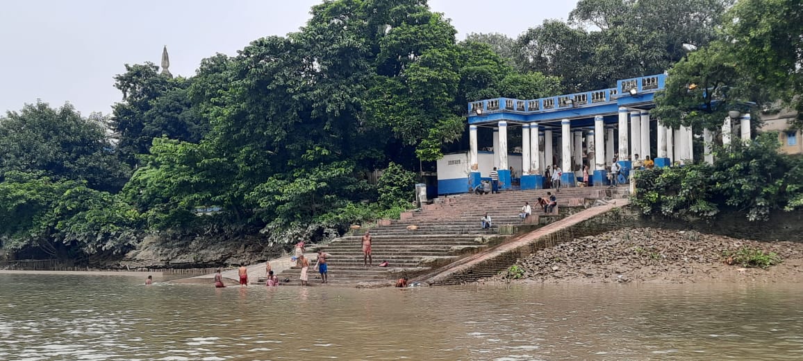 Divotees in Dakshineswar taking a dip in the Ganges