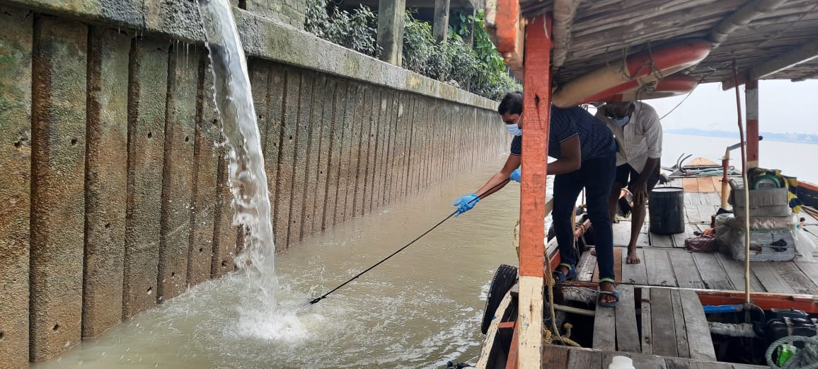 Researchers collecting sample from the Ganges near Dakshineswar