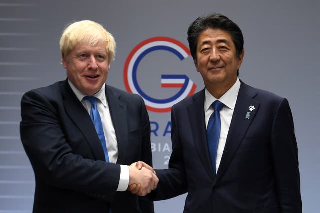 Boris Johnson with then-prime minister Shinzo Abe in 2019 (Neil Hall/PA)