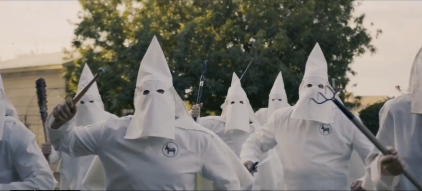 Jerone Davison shared a campaign ad that shows people dressed in Ku Klux Klan garb while attempting to attack his home