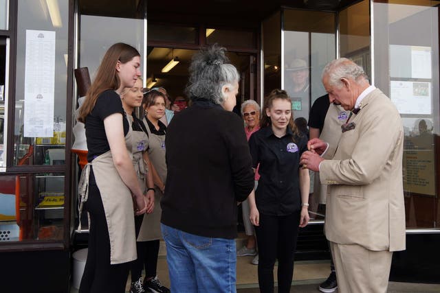 The Prince of Wales receives an ice cream after a visit to the Winter Gardens in Morecambe, Lancashire (Peter Byrne/PA)