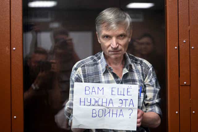 <p>Alexei Gorinov stands with a poster reading, ‘Do you still need this war?’ </p>