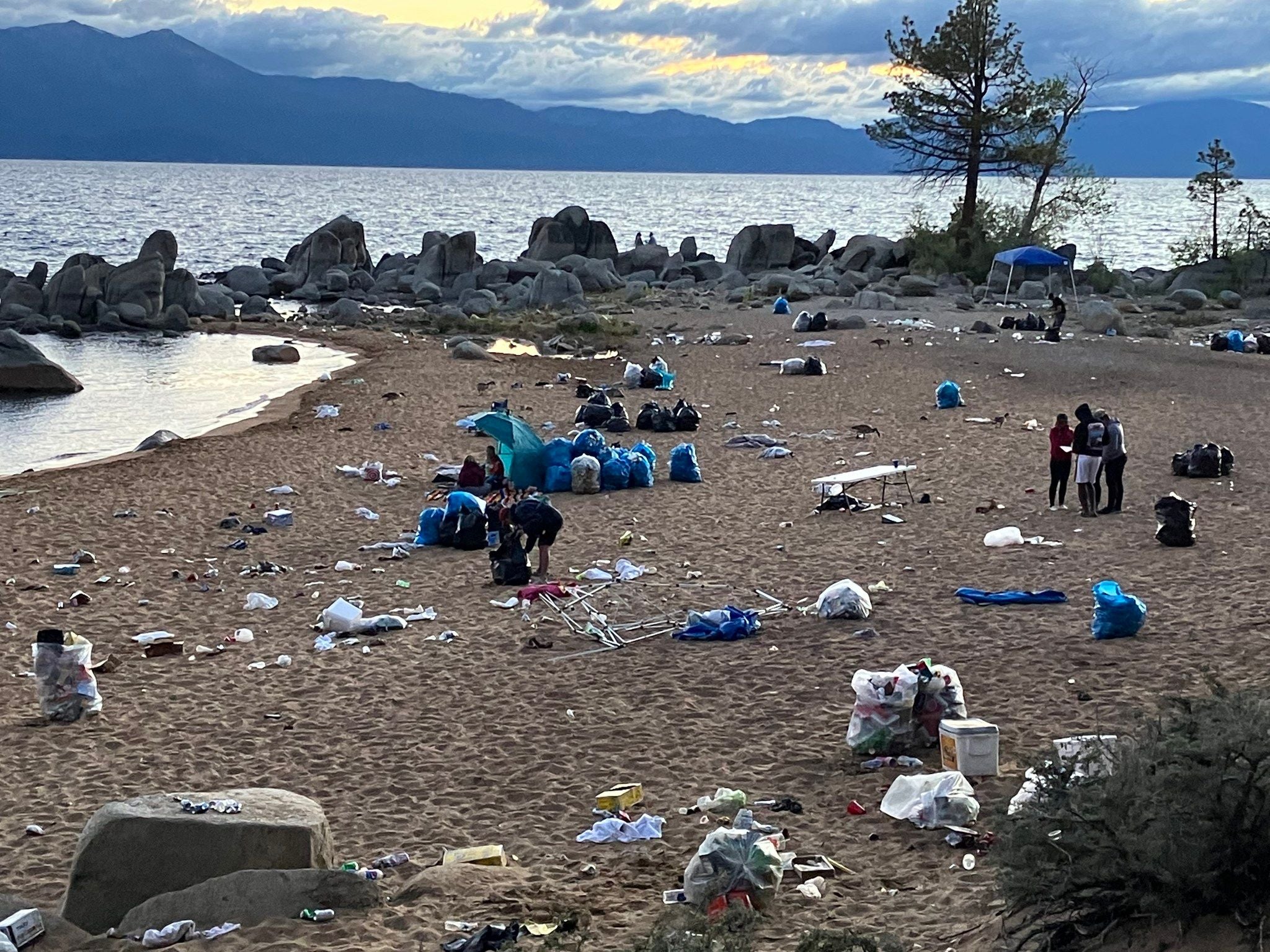 <p>Trash piled up on the shores of California’s Lake Tahoe after Independence Day </p>