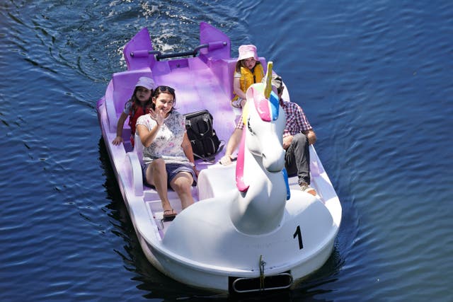 A family use a unicorn-themed pedalo on the River Avon in Warwick (Jacob King/PA)