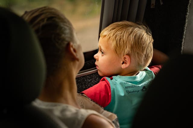 <p>A toddler looks out the window of an evacuation bus The Independent joined bringing civilians out of frontline Donbas towns  </p>