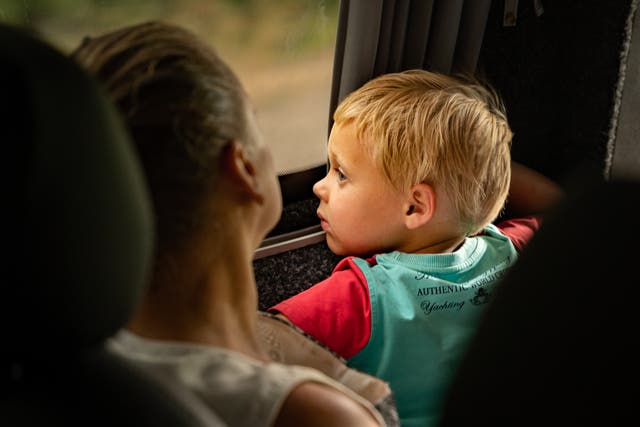 <p>A toddler looks out the window of an evacuation bus The Independent joined bringing civilians out of frontline Donbas towns  </p>