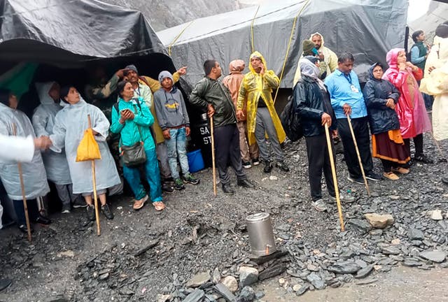 <p>Hindu devotees are seen stranded after a cloudburst near the base camp of the holy cave shrine of Amarnath in south of Kashmir Himalayas, in India, Friday, 8 July 2022</p>