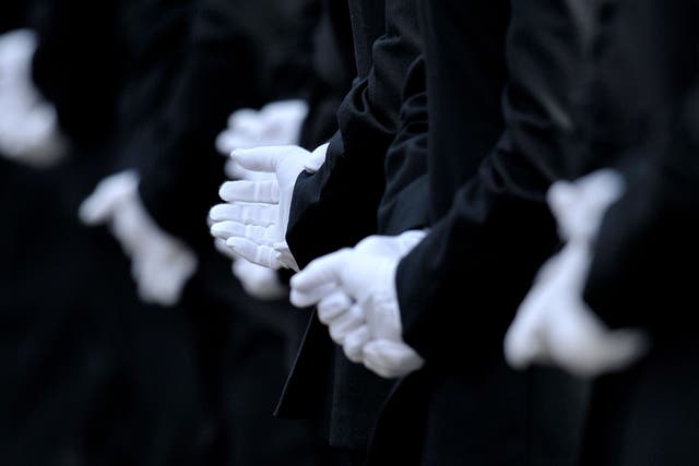 Metropolitan Police officers wearing white dress uniform gloves during a Metropolitan Police passing out parade for new officers at Peel House in Hendon (Nick Ansell/PA)
