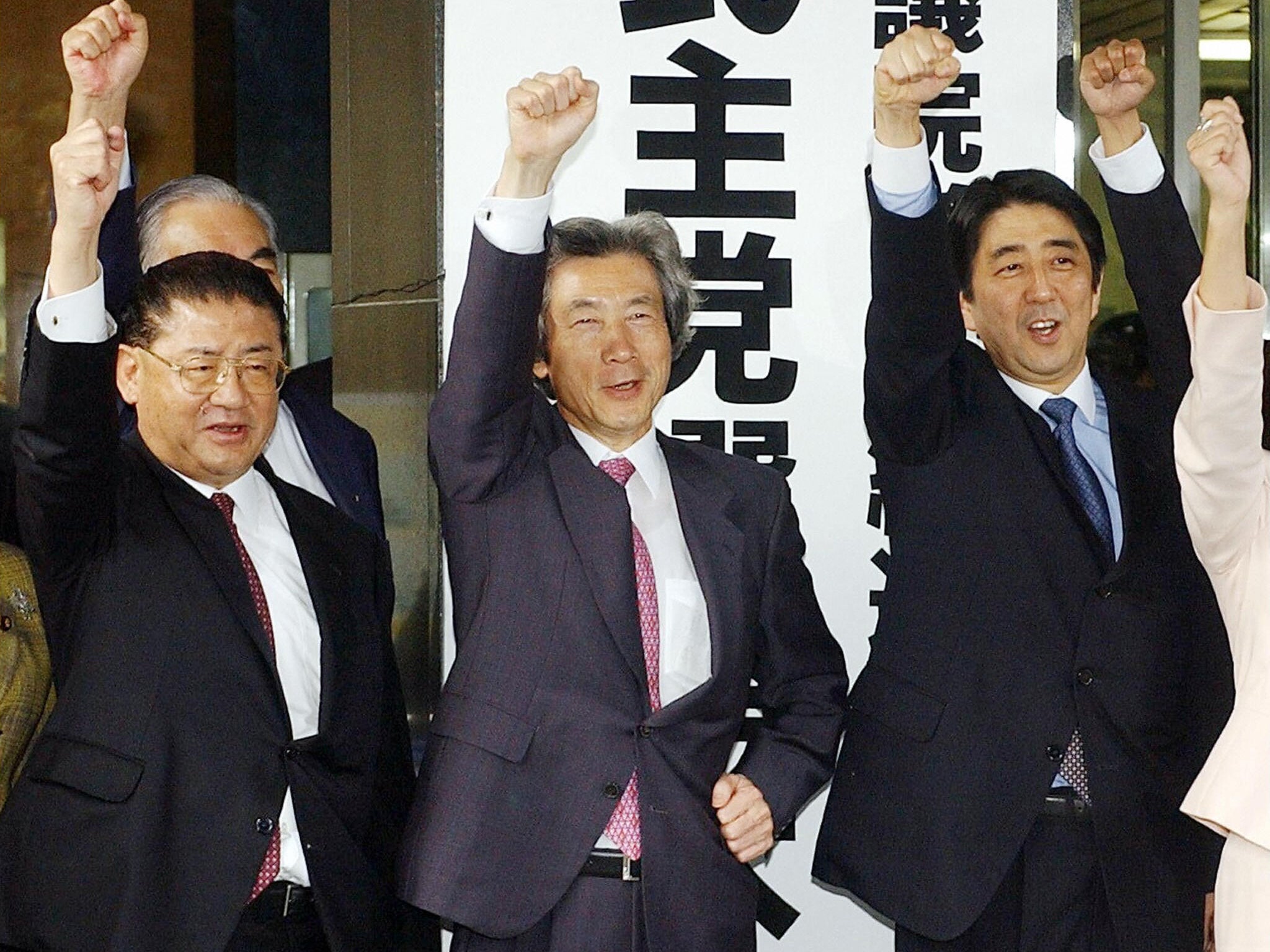 Shinzo Abe (right) with the then Japanese prime minister Junichiro Koizumi (centre) and vice-president Taku Yamazaki (left) in 2003