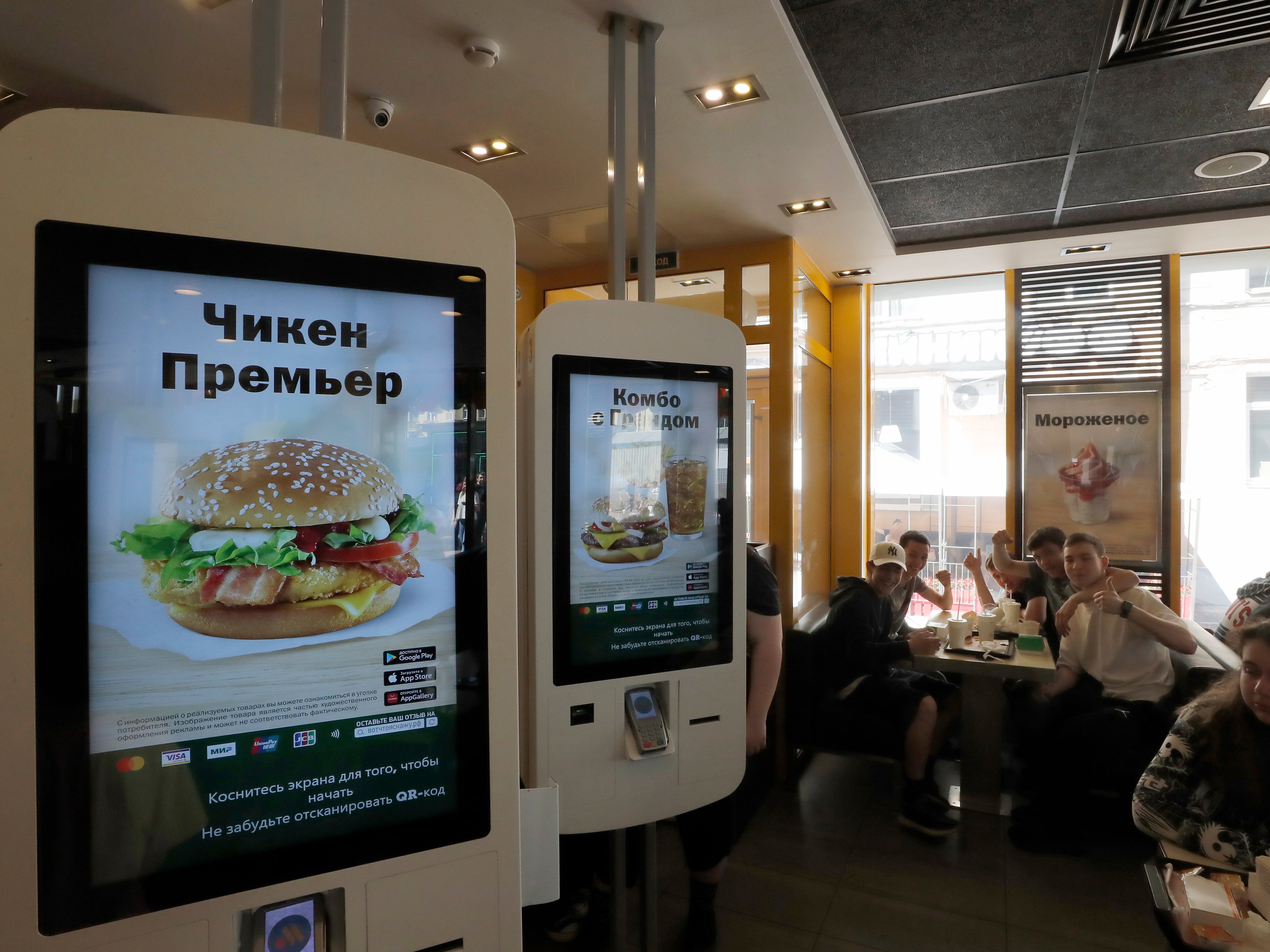 People eat at a former McDonald’s restaurant during reopening under the new brand Vkusno I Tochka in Russia
