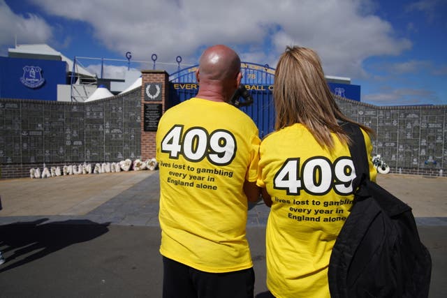 Families of gambling addict suicide victims outside Everton Football Club (Peter Byrne/PA)