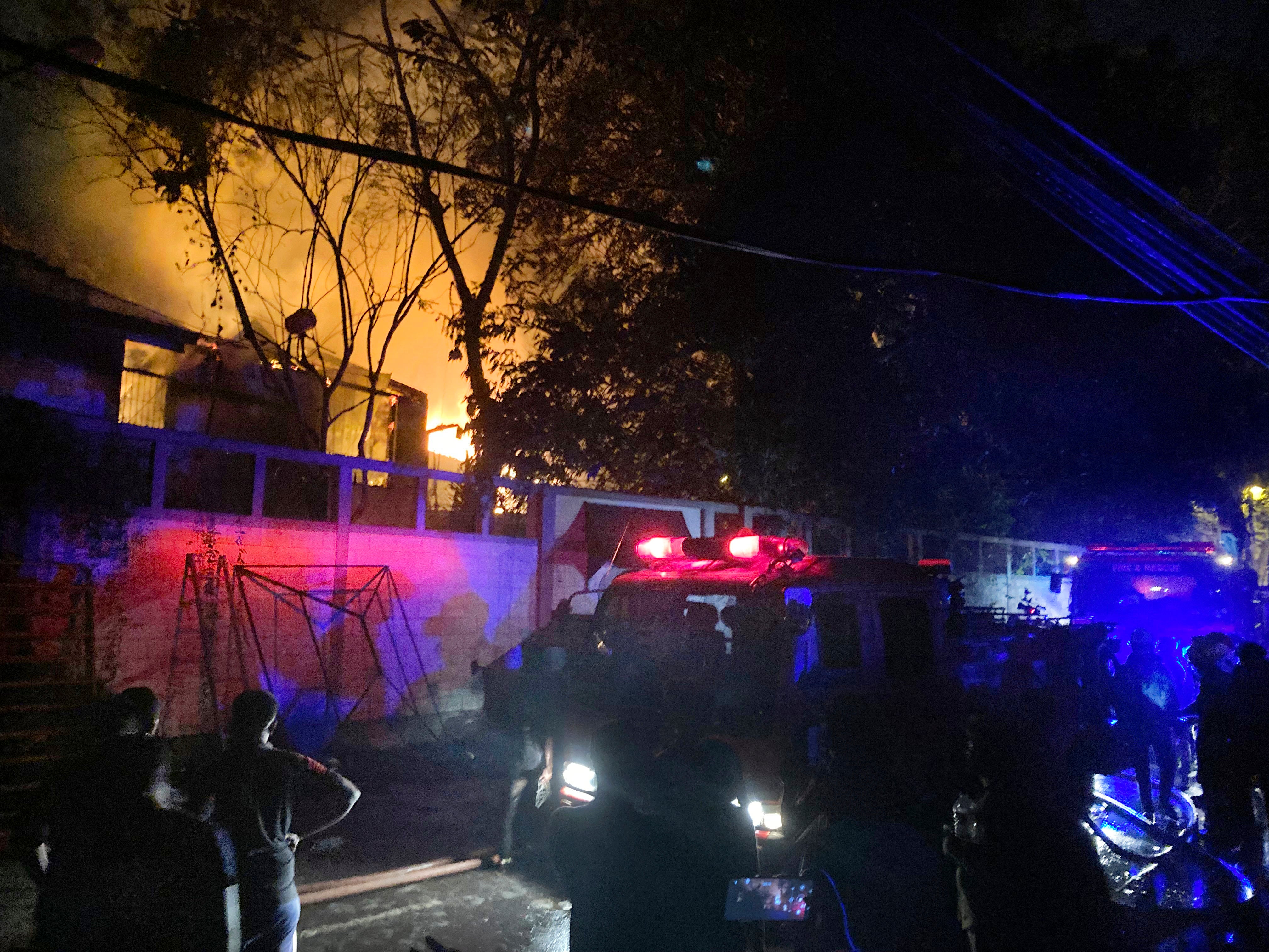 Firefighters try to douse a fire at the Sri Lankan prime minister Ranil Wickremesinghe’s private residence