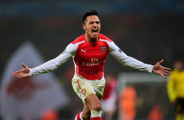 Alexis Sanchez swapped the Nou Camp for the Emirates Stadium on this day in 2014 (Adam Davy/PA)