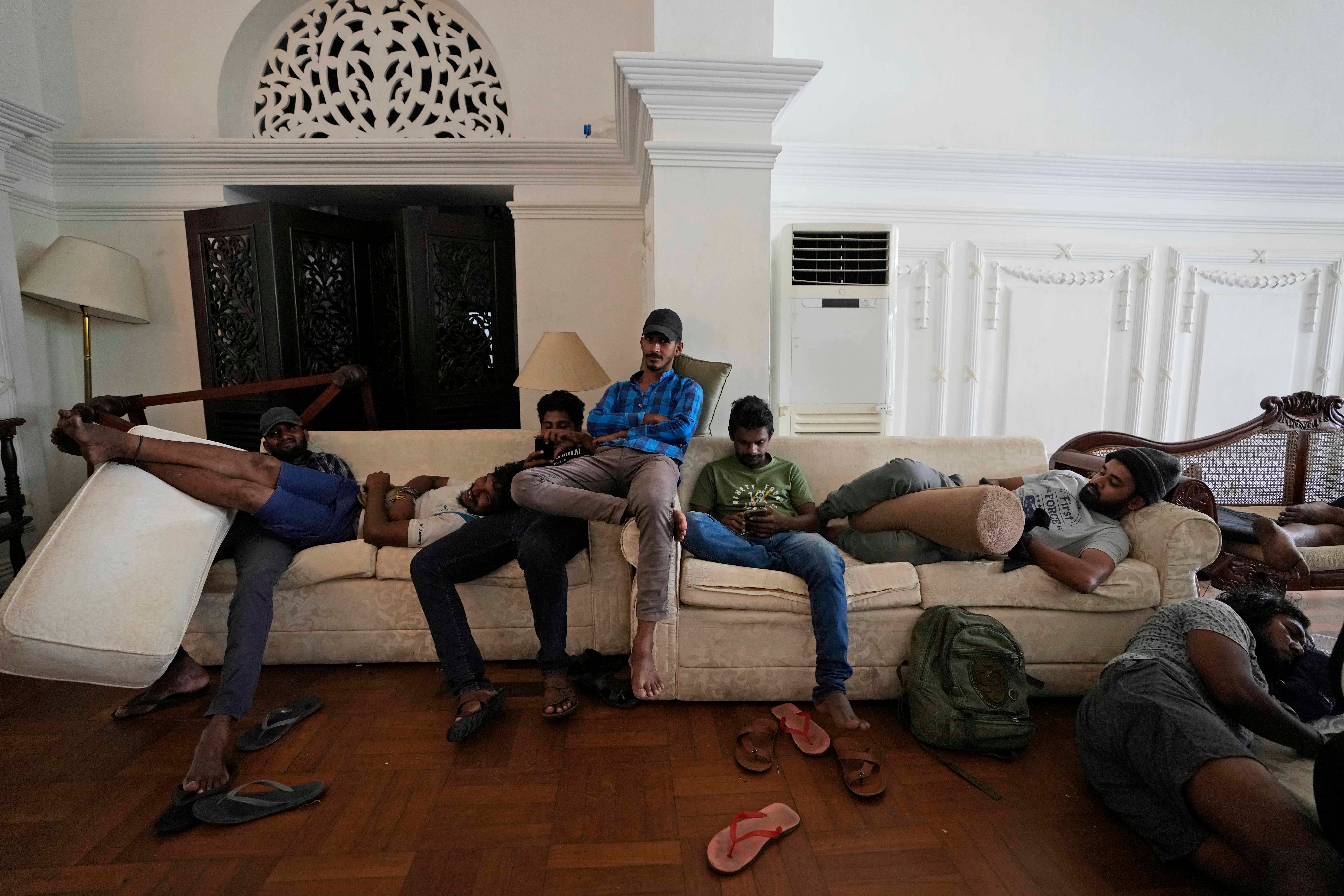 Protesters rest on sofas in prime minister’s house