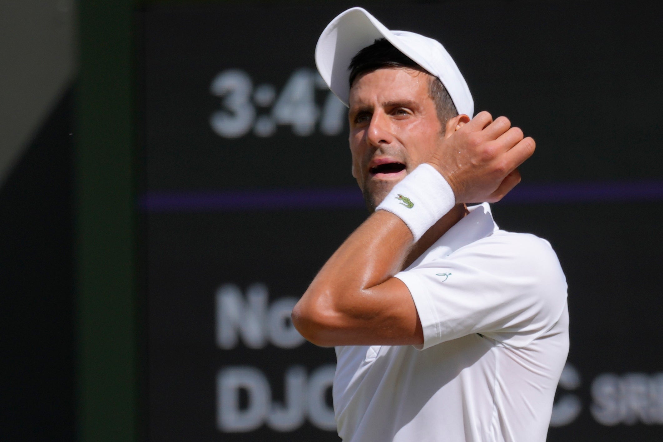 Serbia's Novak Djokovic wipes his face
