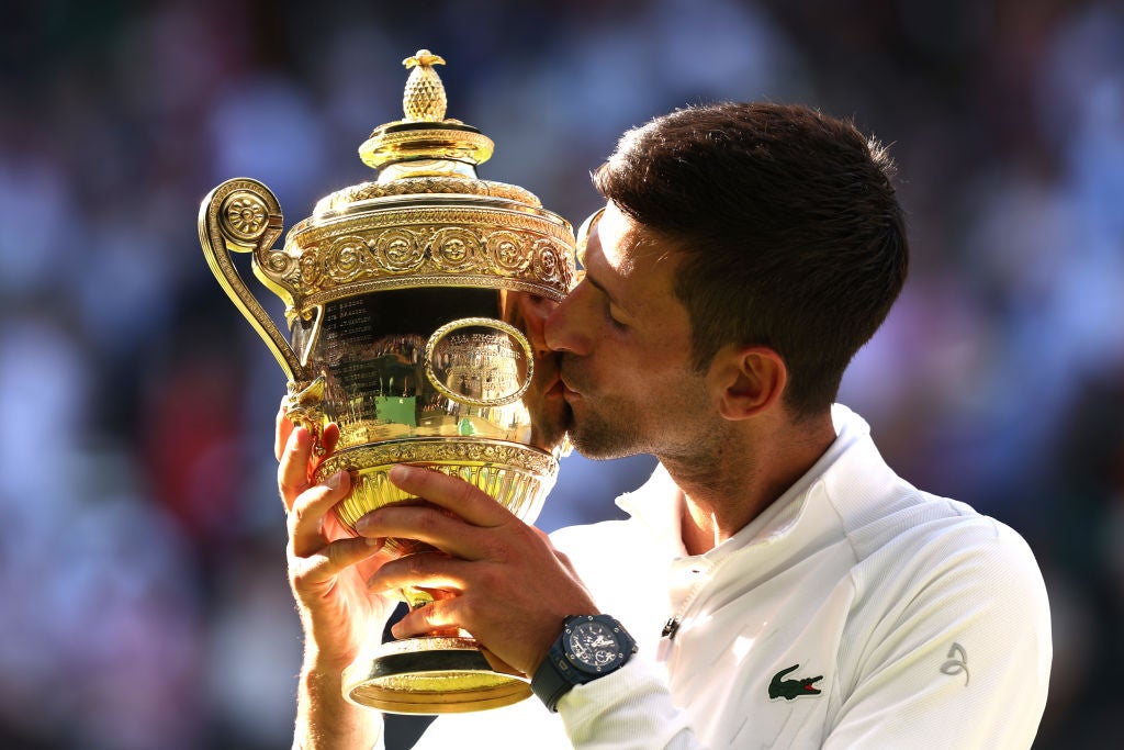 Novak Djokovic celebrates his fourth Wimbledon in a row