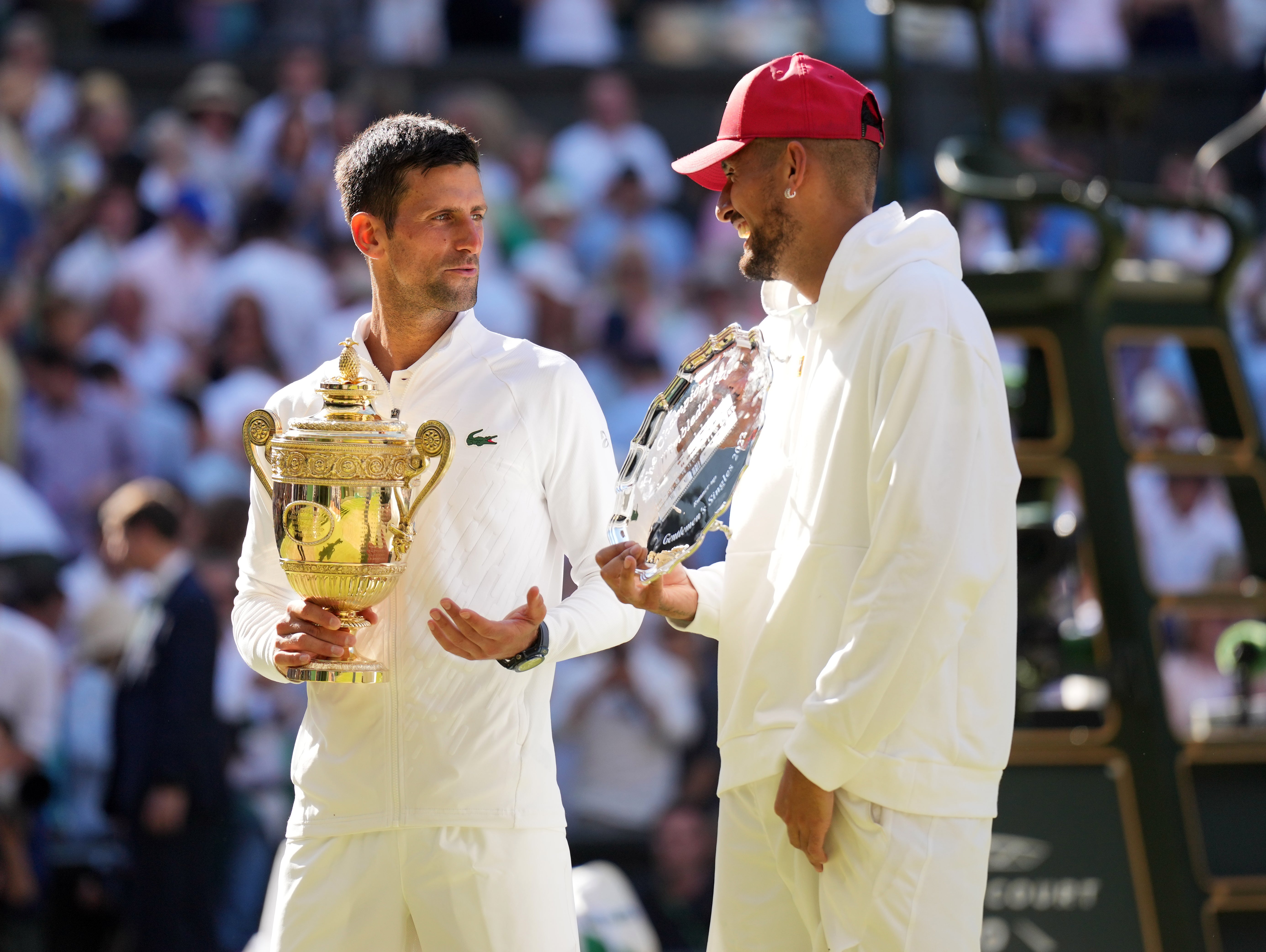 Novak Djokovic shares a laugh with Nick Kyrgios after their Centre Court battle where the winner declared their friendship officially a ‘bromance’ after the final (Zac Goodwin/PA)