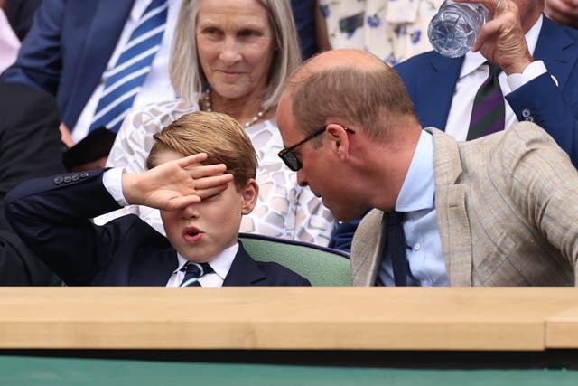 <p>Prince William, Duke of Cambridge (R) and Prince George of Cambridge interact in the Royal Box watching Novak Djokovic of Serbia play Nick Kyrgios of Australia during their Men's Singles Final match</p>