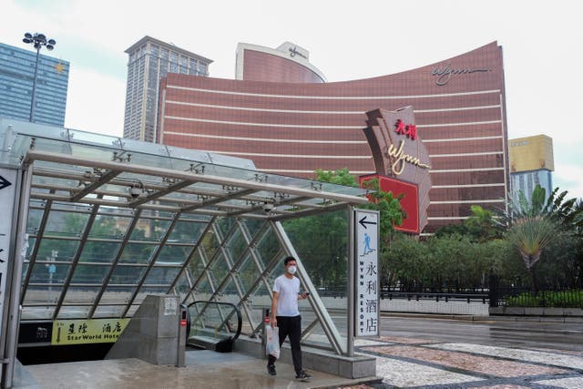 <p>A man walks outside a casino resort amid a coronavirus disease outbreak in Macau on 4 July</p>