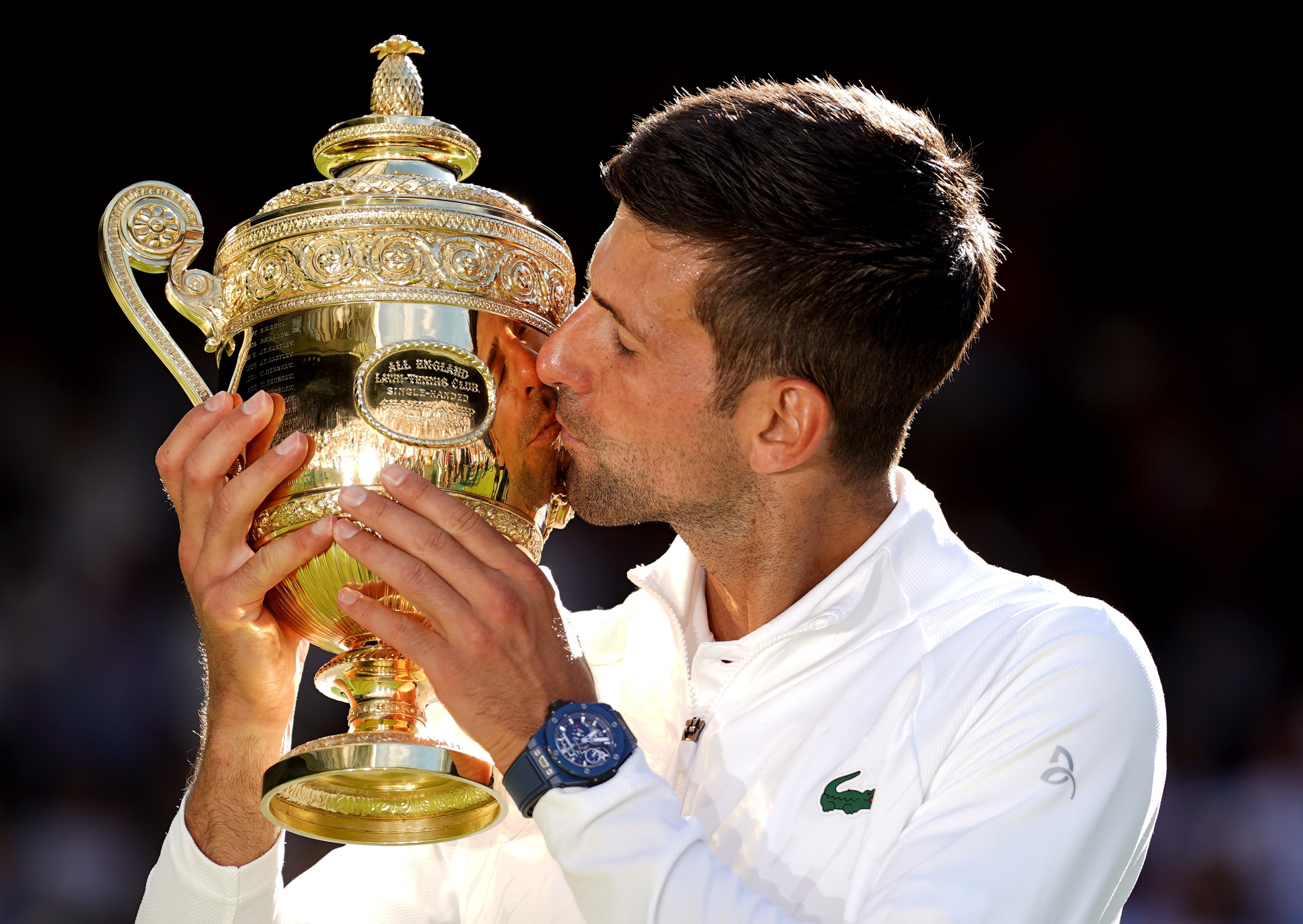 Novak Djokovic kisses the Wimbledon trophy (Adam Davy/PA)