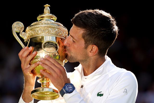 Novak Djokovic kisses the Wimbledon trophy (Adam Davy/PA)