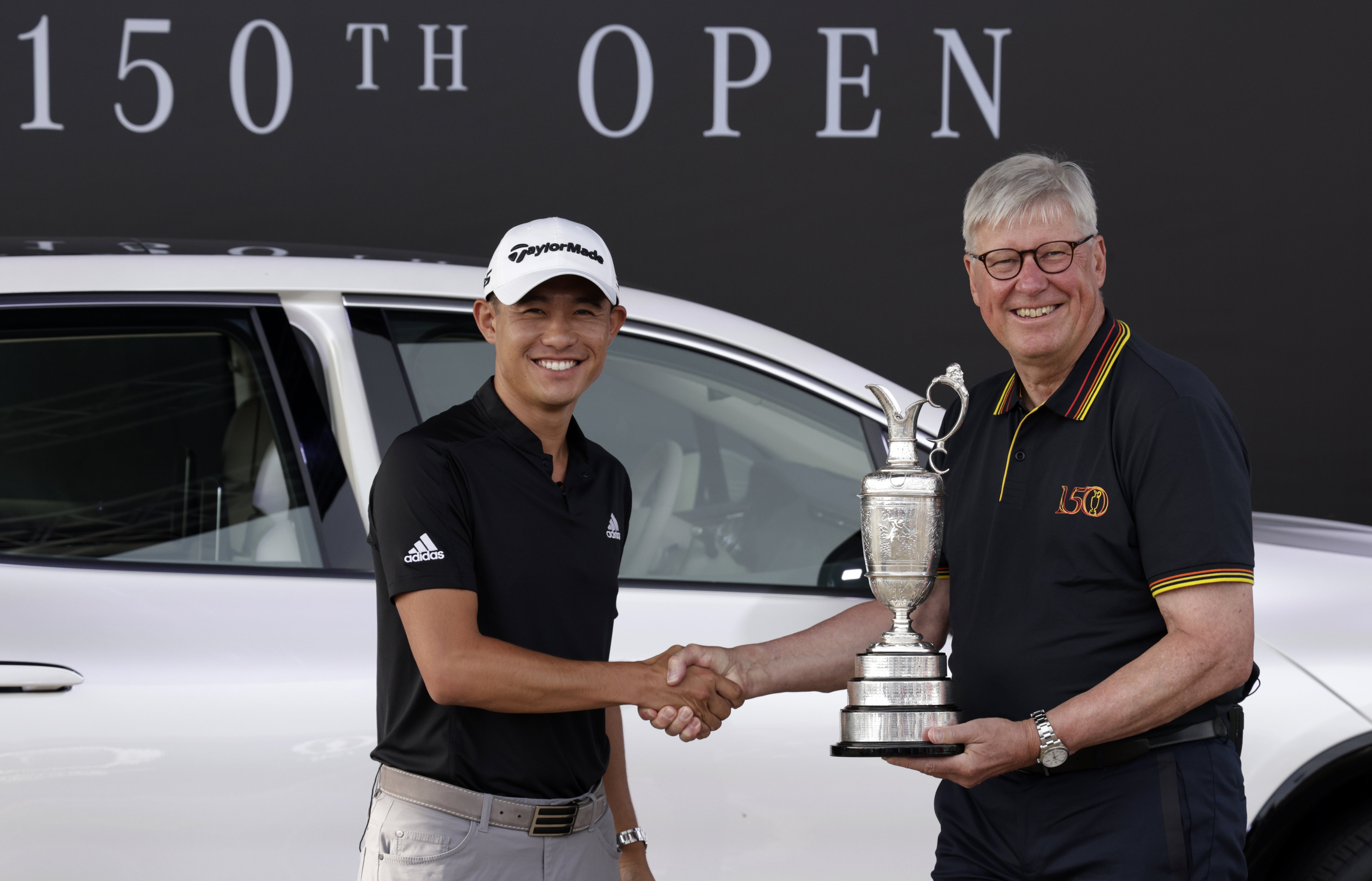 Collin Morikawa (left) returns the Claret Jug to R&A chief executive Martin Slumbers, ahead of The 150th Open Championship (Richard Sellers/PA)