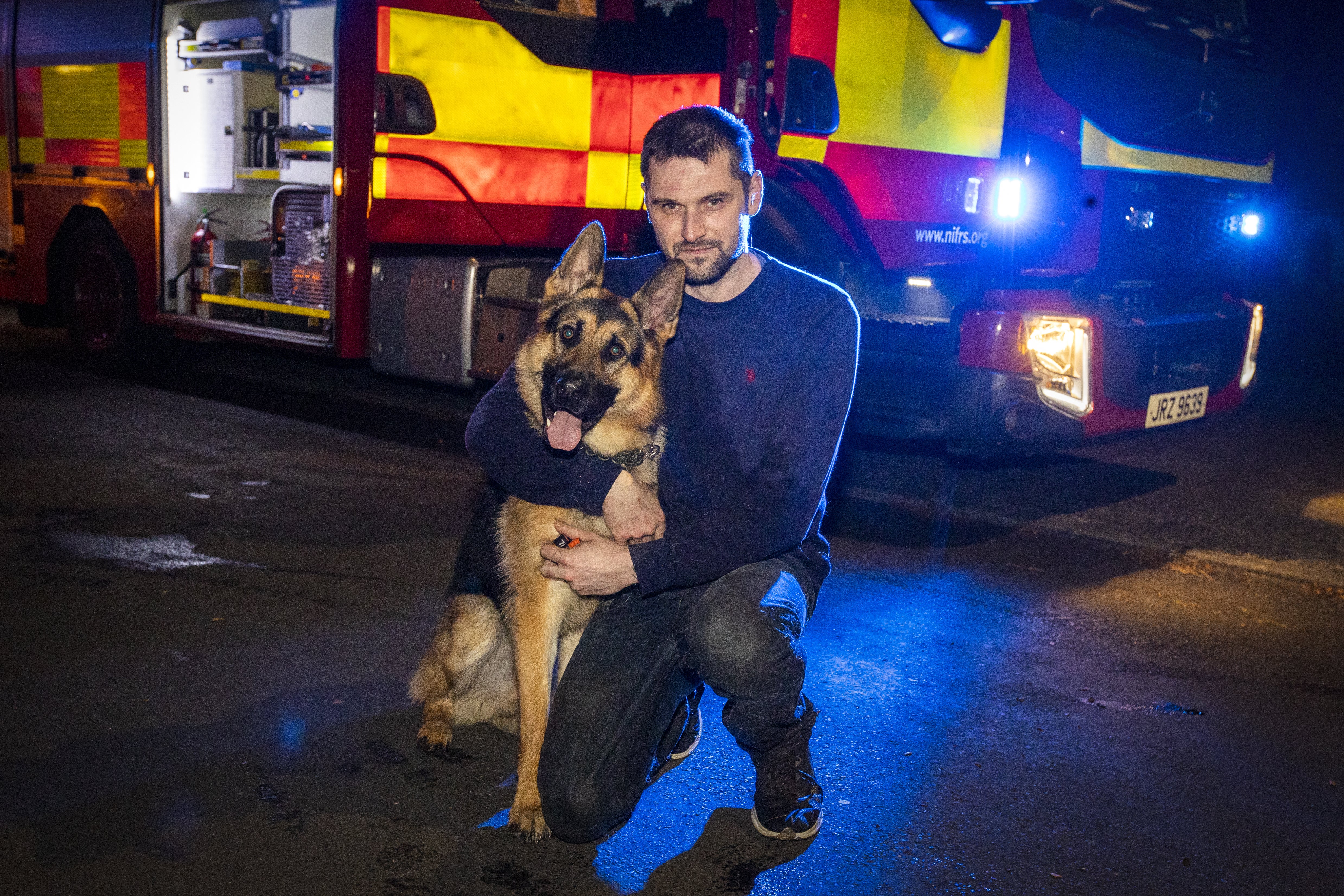 19-month-old German Shepherd Koba with owner William Herron after Northern Ireland Fire and Rescue Service (NIFRS) were called to help rescue the dog from the river close to Magheramorne Presbyterian Church outside Larne, Co Antrim. (Liam McBurney/PA)