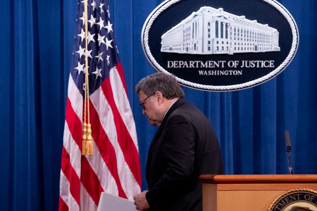 <p>Bill Barr walks away from the podium after a press conference</p>