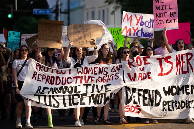 <p>File photo: A large crowd marches during a student-led protest in Minneapolis on 24 June</p>