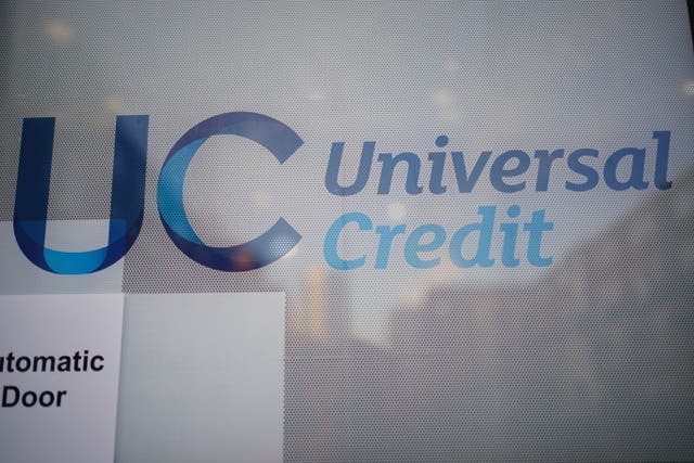 A Universal Credit sign on a door of a job centre plus, (Yui Mok/PA)