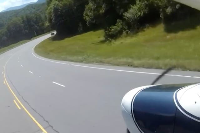 <p>A GoPro filmed the moment when a small plane made an emergency landing on a highway in North Carolina</p>