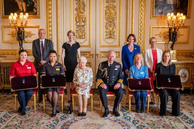 Joanna Hogg, Peter May, May Parsons, Amanda Pritchard, the Queen, the Prince of Wales, Caroline Lamb, Eleanor Grant Judith Paget and Dr Ami Jones after an Audience at Windsor Castle, Berkshire (Aaron Chown/PA)