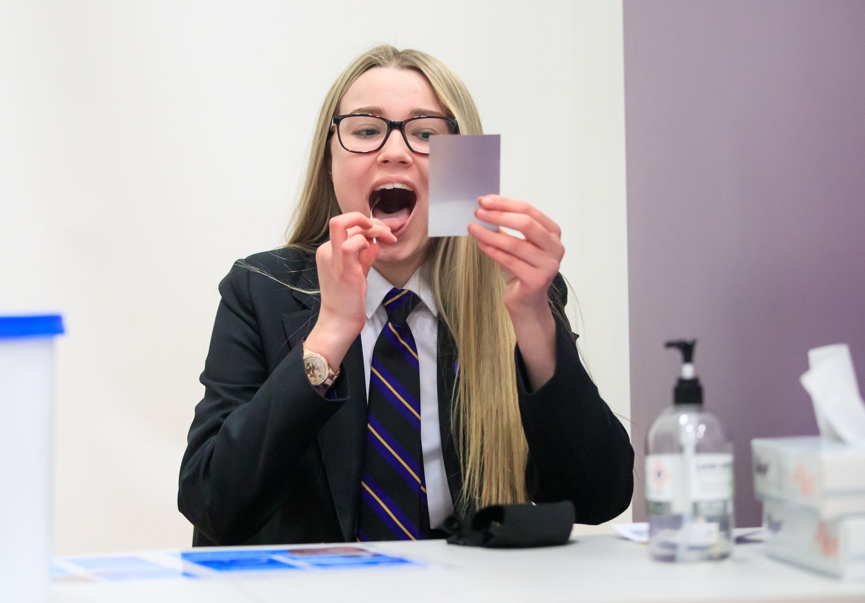 File photo dated 08/03/21 of pupil Erin Horn taking a lateral flow test at Outwood Academy in Doncaster in Yorkshire. Education unions are warning high absence rates in schools (Danny Lawson/PA)