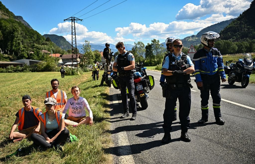 Demonstrators are cleared to the side of the road