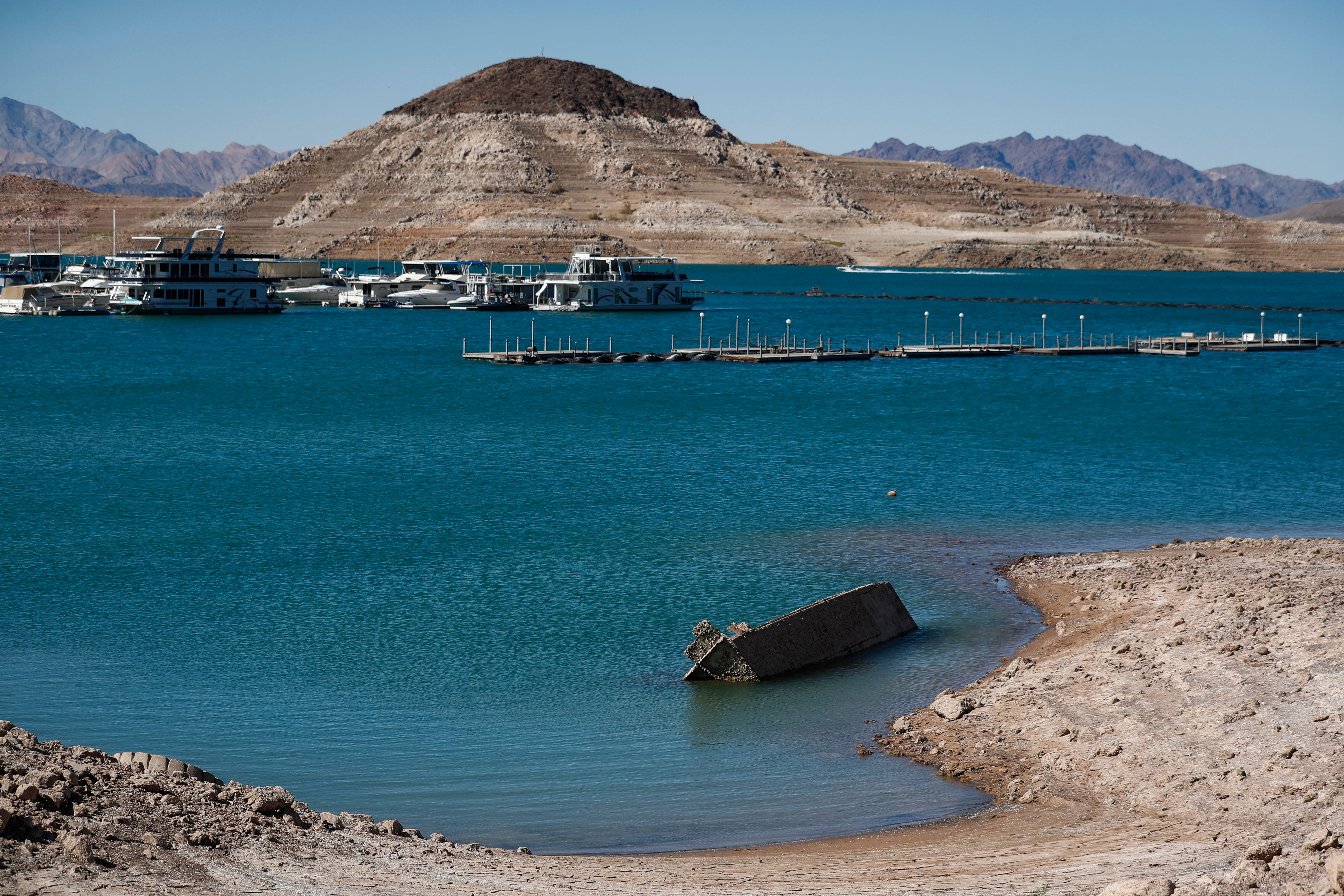 The landing craft, as seen from the receding shoreline of Lake Mead
