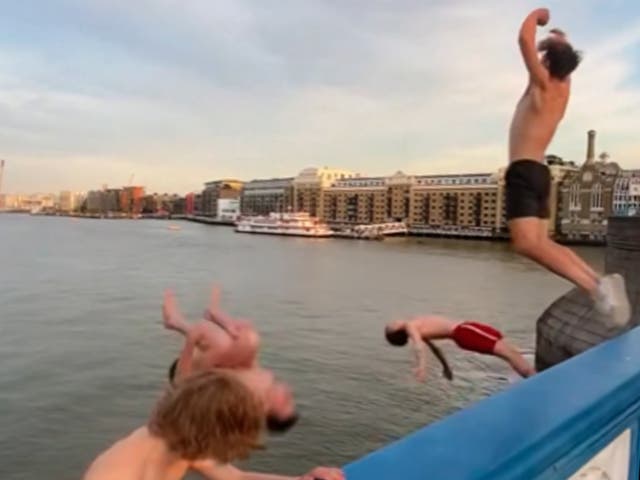 <p>The group of four lept off Tower Bridge into the Thames as Britain basks in a heatwave </p>