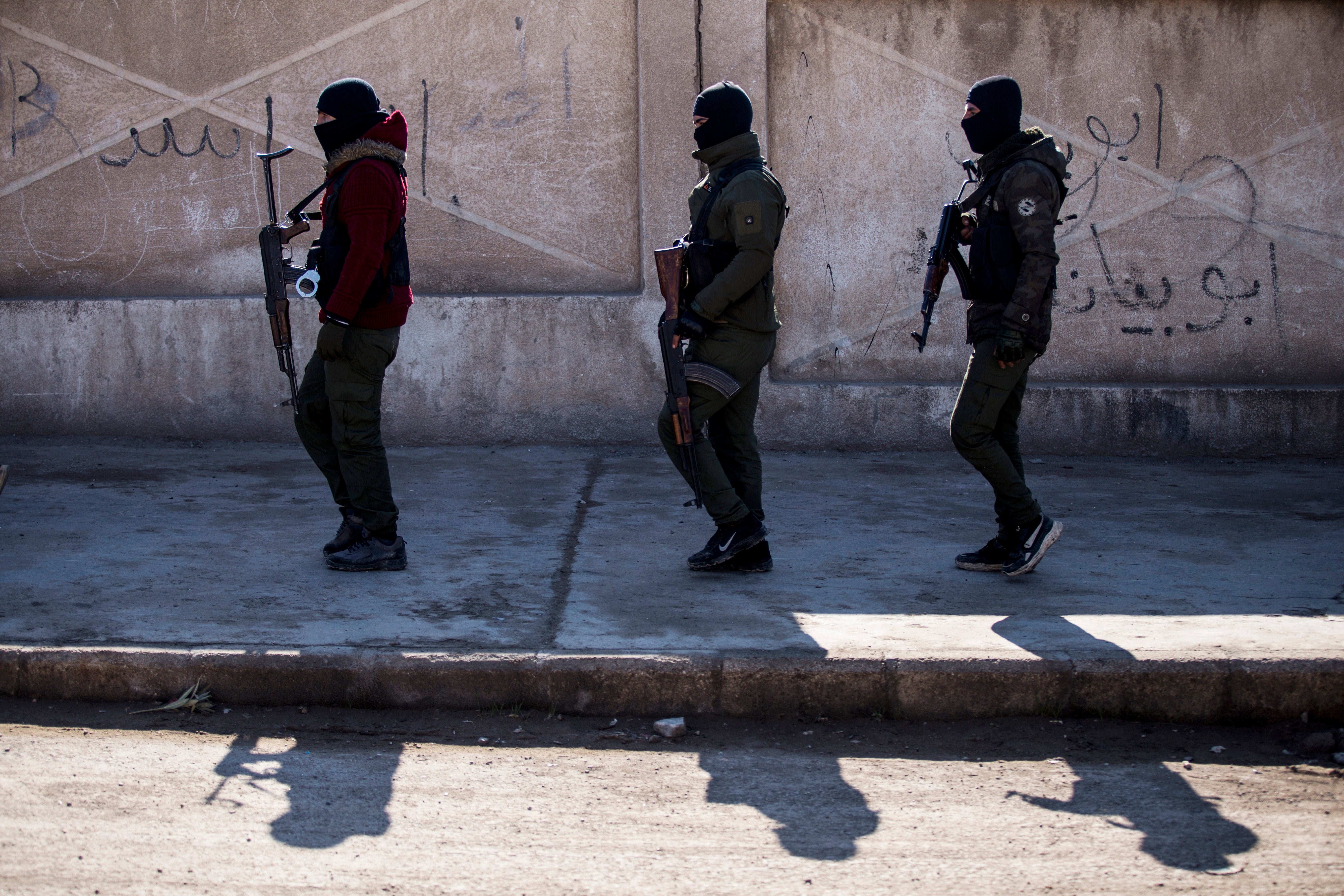 US backed Syrian Democratic Forces soldiers search for Islamic State militants in Syria