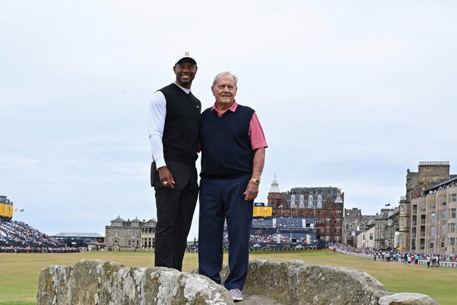 <p>Open winners Woods (left) and Jack Nicklaus on the Swilcan Bridge at the iconic Old Course </p>