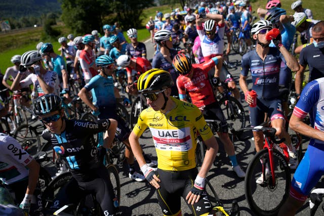 <p>Tadej Pogacar was held up by protestors before narrowly holding on to his yellow jersey</p>