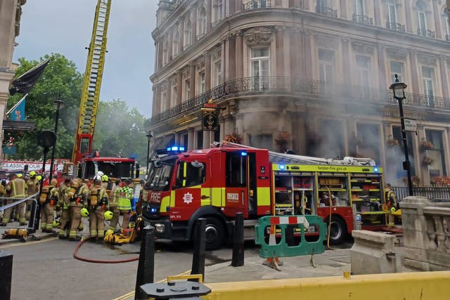 Firefighters battle a blaze in the basement of The Admiralty pub in Trafalgar Square (London Fire Brigade/PA)