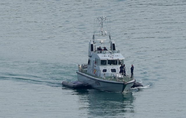 Royal Navy HMS Blazer tows two small boats. The Government abandoned its plan to use controversial pushback tactics to turn away migrants in the Channel after trials (Gareth Fuller/PA)